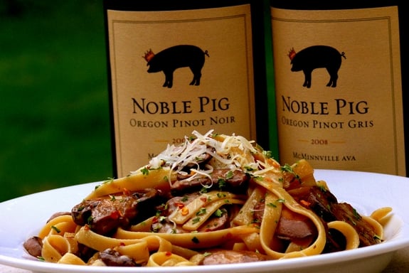 Mushroom fettucine with Noble Pig Pinot Noir wine in the background.