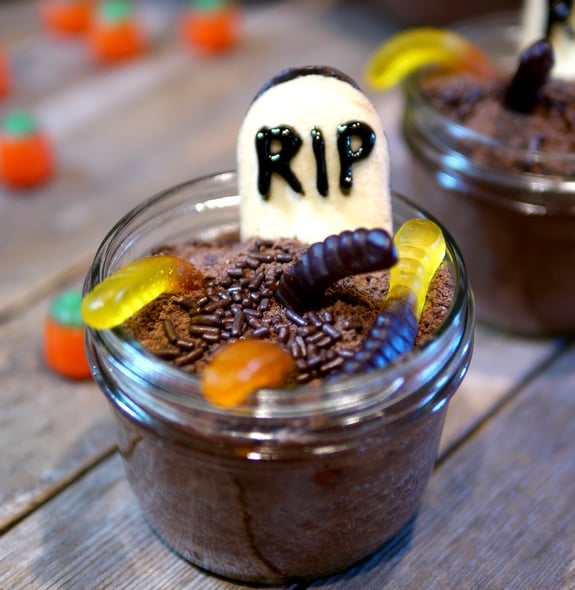 Mason Jar Graveyard Spooky Cakes - Mason Jar Graveyard Spooky Cakes are little chocolate cakes that are baked in jar s and decorated to look like cute but creepy graveyards for Halloween! 