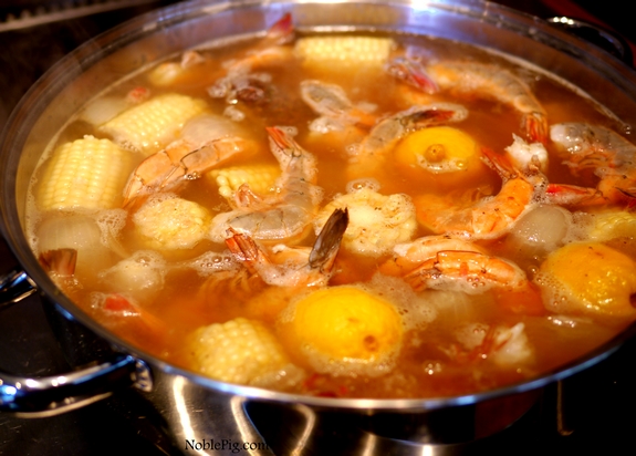 Noble Pig Low Country Shrimp Boil in a large pot on the stove.
