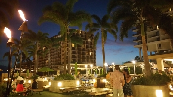 Embassy Suites Waikiki Beach Walk pool area in the evening