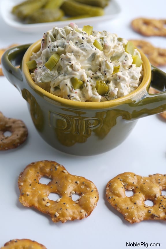 Dill Pickle Dip in a bowl surrounded by pretzels.