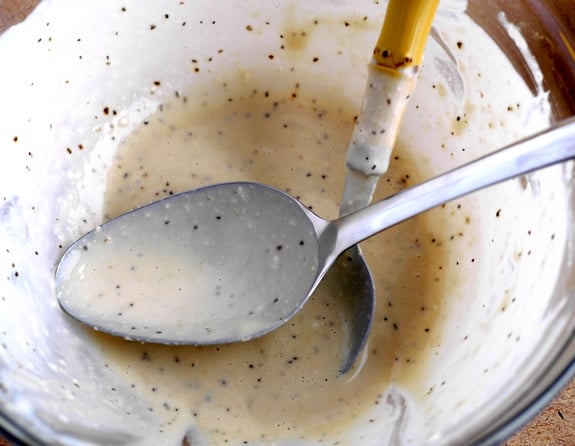 Creamy Parmesan Salad Dressing in the bowl with a spoon.