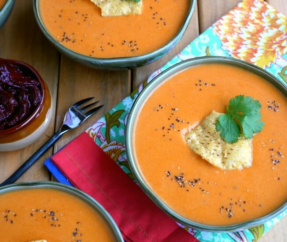 Overhead of three bowls of Creamy Tomato Chipotle Soup 