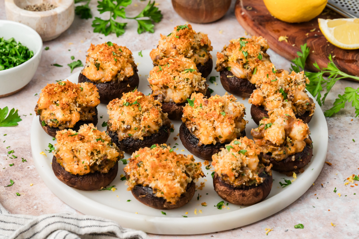 Shrimp Stuffed Mushrooms Platter with Parmesan Panko Platter of shrimp stuffed mushrooms topped with Parmesan panko, parsley and fresh lemon zest