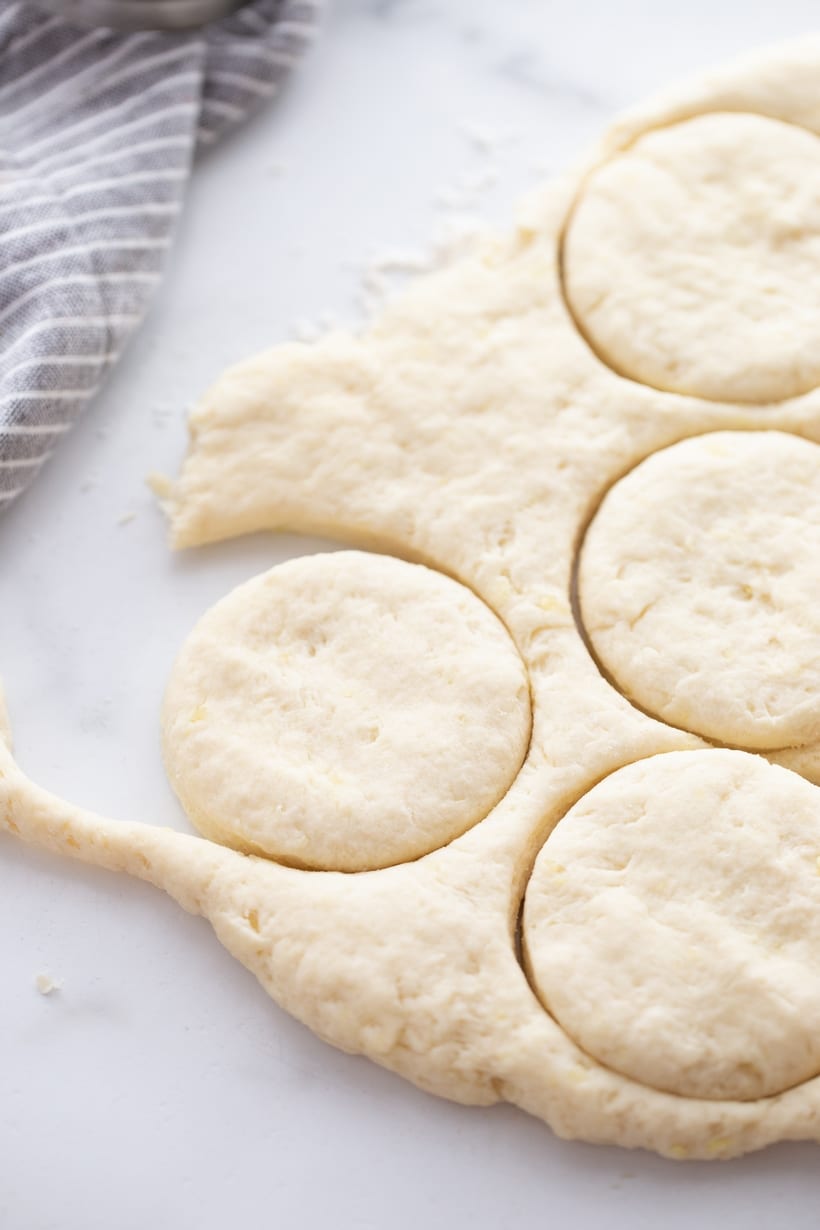 Cutting out biscuits from dough.