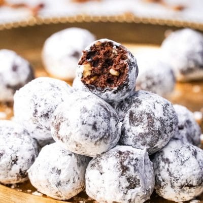 Sophisticated and elegant, these Zinfandel Port Balls are a festive dessert for any occasion. The port and cocoa meld together, erupting into a smooth and warming flavor, sans any raw alcohol taste. Perfect for gifting too. #noblepig #port #portwine #zinfandel #zinfandeldessert #dessert #dessertballs #cocoa #homemadegifting #homemadegift #ediblegift #winedessert #dessertwine #holidaygift #valentinesdessert #newyearseve #christmasdessert