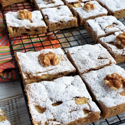 Fresh apple spice bars on a cooling rack.
