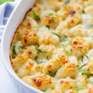 Gnocchi mac and cheese in a white serving bowl.
