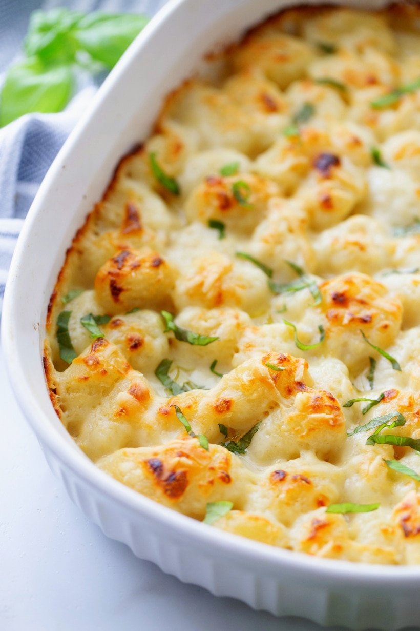 Gnocchi mac and cheese in a white serving dish.
