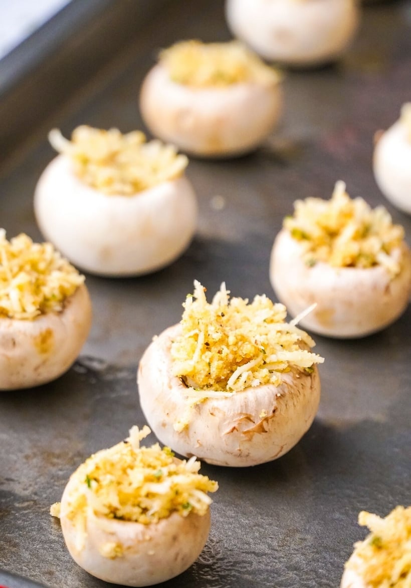 These Italian Stuffed Mushrooms are the perfect party appetizer for any occasion. Put these stuffed mushrooms together early in the day and bake them off right before guests arrive. #noblepig #mushrooms #italianstuffedmushrooms #partyappetizer #partyappetizerforacrowd #mushrromappetizer #stuffedmushrooms #italianfood #italianappetizer #partyfood