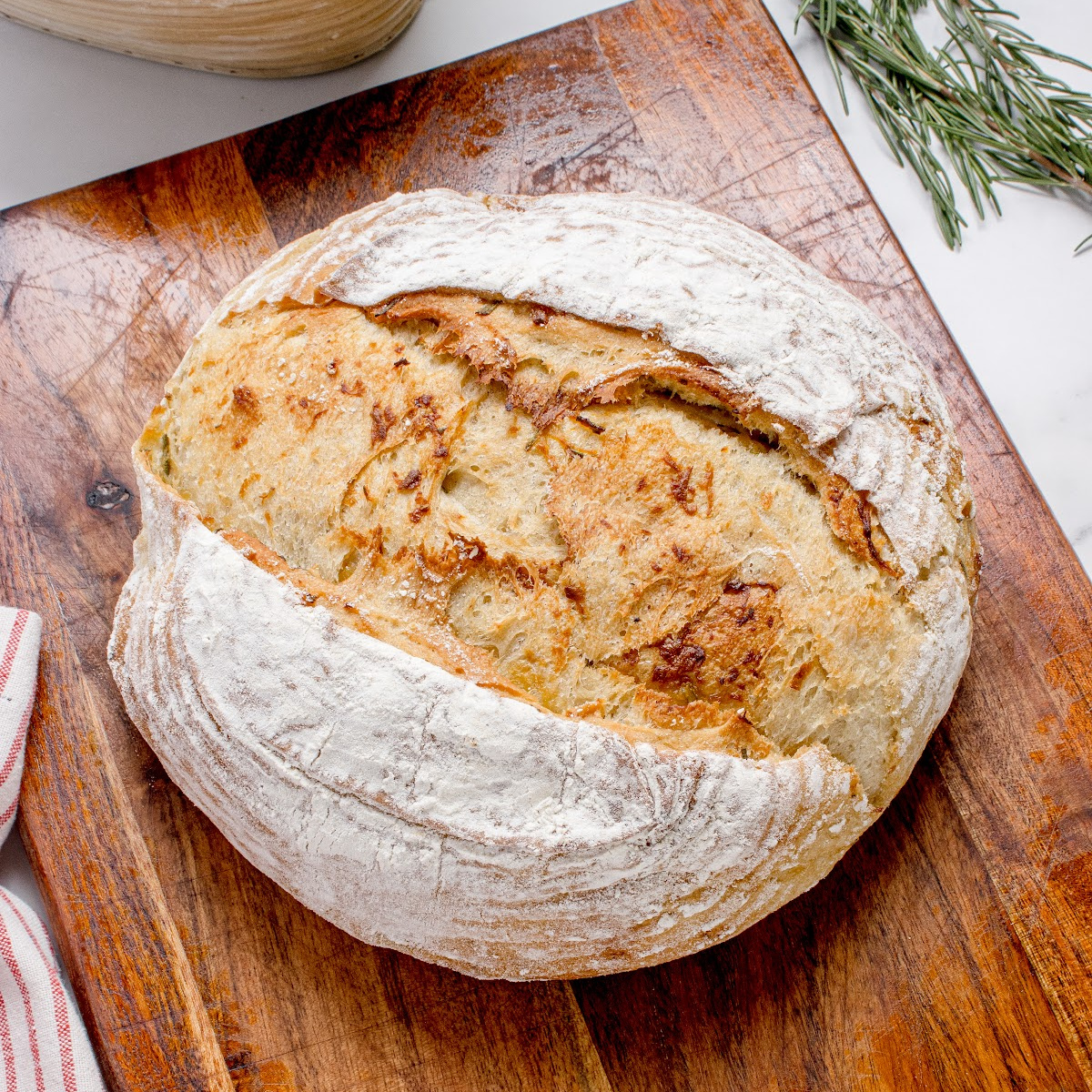 Roasted garlic rosemary artisan bread baked until golden brown with a rustic artisan crust