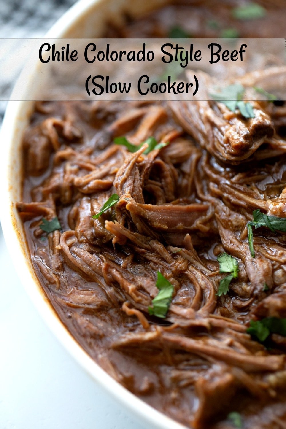Chile Colorado Style Beef made in the slow cooker in a simple and easy way. Serve it in a warm tortilla and enjoy it's deliciousness. The leftovers, if there are any, are also amazing.  via @cmpollak1
