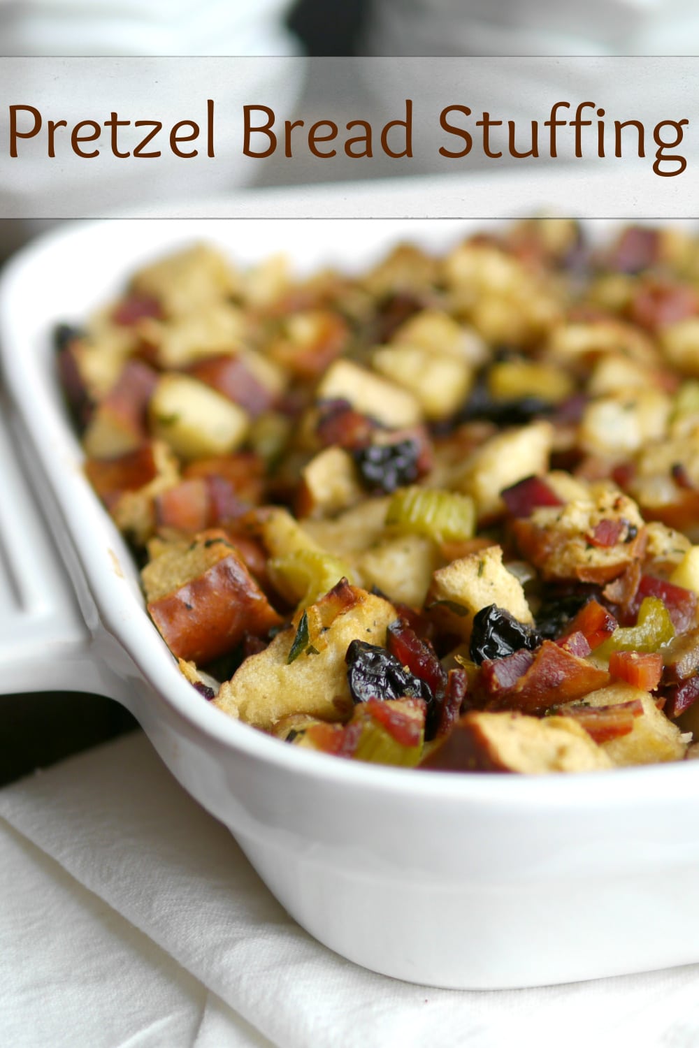 This Pretzel Bread Stuffing is a crave-worthy recipe you'll  want to serve again and again. This unconventional stuffing twist, packed with the perfect blend of pretzel bread, thick-cut bacon, apple, and more, will have you hooked from the very first bite—irresistible and non-traditional, it's a flavor adventure you won't want to end. via @cmpollak1