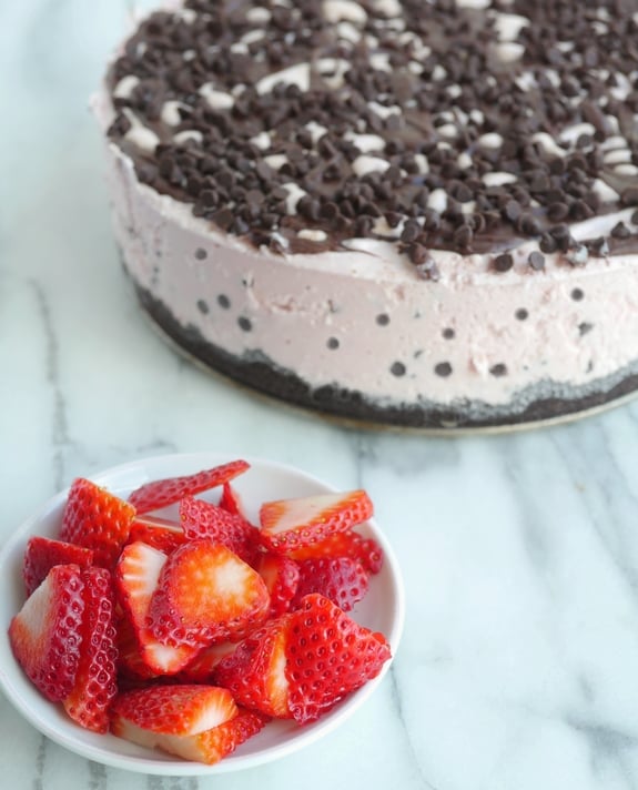 The Best Strawberry Chocolate Chip Ice Cream Cake Recipe from NoblePig.com. An easy frozen dessert perfect for any celebration. This recipe also has a video tutorial. #noblepig #frozen #frozenparty #strawberry #icecreamcake #icecream