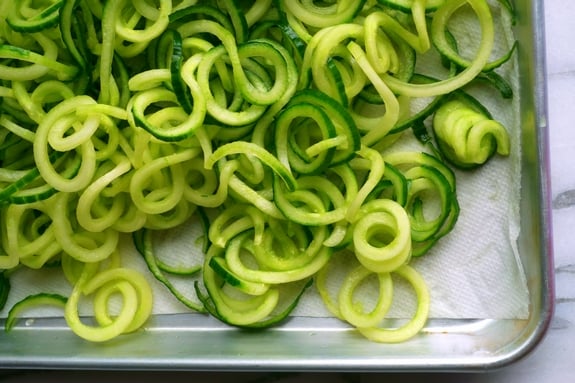 Spiralized cucumber on a tray.
