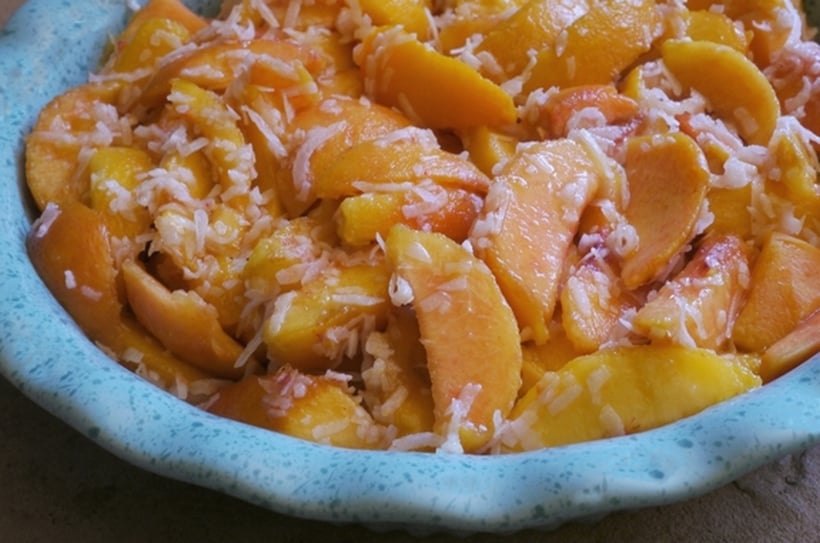 Take advantage of the season's sweetest and ripest fruit with this Coconut Peach Crumble. And don't forget that scoop of vanilla bean ice cream on top from NoblePig.com #noblepig #peach #peachdessert #peaches #coconutdessert