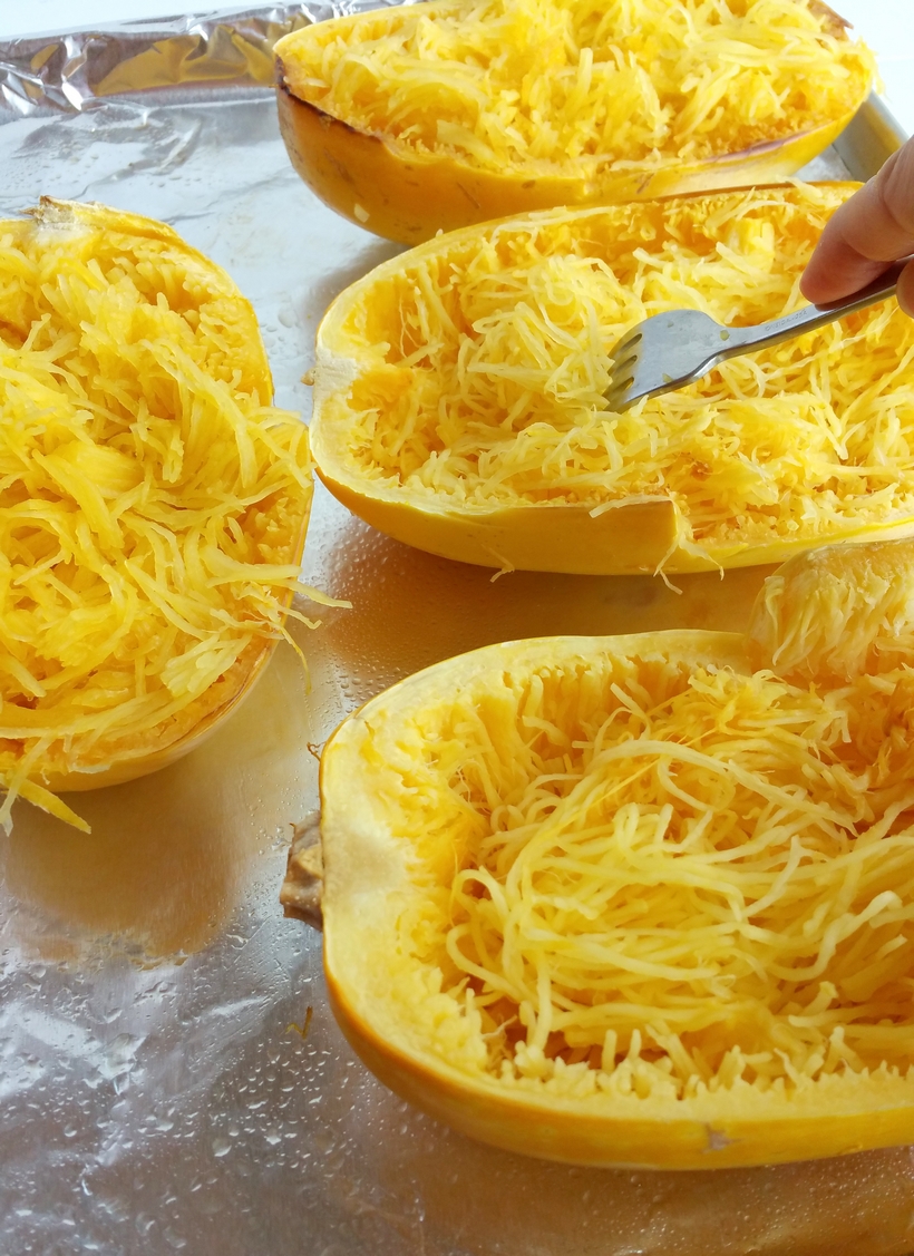 Stuffed Spicy Italian Spaghetti Squash Boats ~ All the flavors of a hearty spaghetti dinner packed into a tender, roasted spaghetti squash. This Stuffed Spicy Italian Spaghetti Squash Boats recipe are the answer to comfort food made in a healthy way.  A fork is all it takes to separate the pale orange strands of the gourd into vegetable noodles. It couldn't be easier from NoblePig.com. #noblepig #spaghettisquash #italianfood #healthyeats