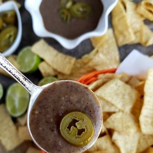 You will be obsessed with this quick and easy 3-Ingredient Blender Salsa that is packed with flavor and spicy heat. Whether you pour it over tacos or use it for chips and dip, I guarantee it will become a fast favorite. #noblepig #salsa #gameday #easyrecipes