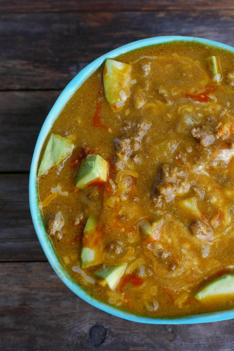 Easy, delicious and ready in under thirty minutes, this Spicy Low Carb Hamburger Soup is a hearty and warming dinner. Since it makes a large batch, there will be enough leftovers for lunches and dinners that week. This soup is keto friendly. #noblepig #keto #ketorecipe #lowcarb #easydinner