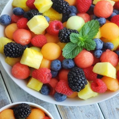 Two bowls of Fruit Salad with Ginger Mint Syrup