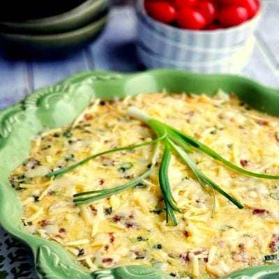 Omelet in a green serving dish.