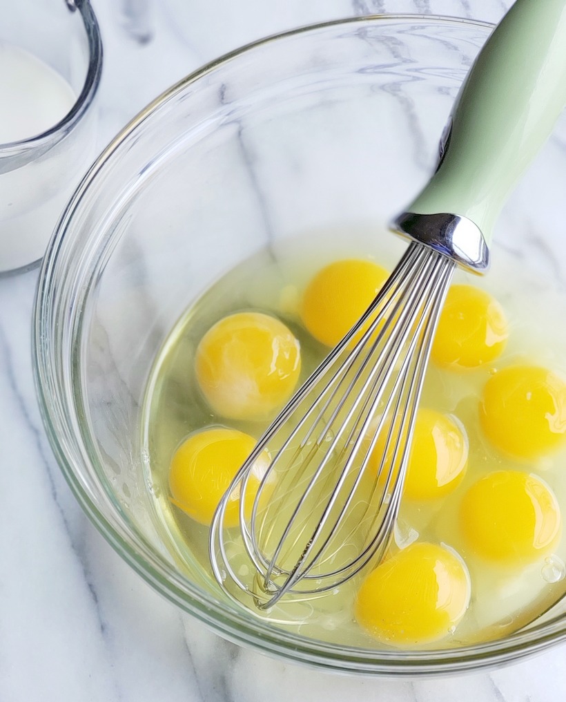 Eggs in a bowl ready to be whisked.