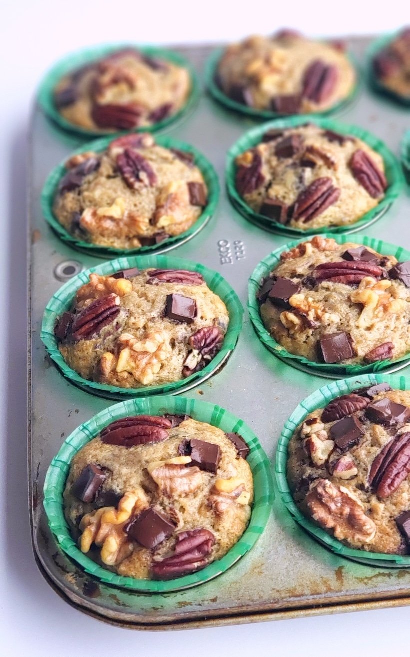 These Eggnog Banana Bread Muffins are baked and sitting in a muffin tin.