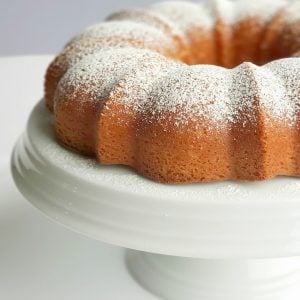 RumChata Bundt Cake on a white cake stand.