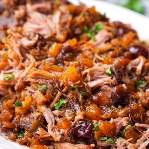 Take the work out of making dinner with this savory and slightly sweet Slow Cooker Pork with Cranberry-Pineapple Sauce. Only five minutes of prep time are needed for this delicious recipe. #slowcooker #slowcookermeal #pork #slowcookerpork #cranberry #pineapple #easyslowcookerrecipe #easyslowcookerrecipes #easydinners #whatsfordinner #dinnerideas #whatshouldimakefordinner #porkroast #pulledpork #cozydinner #whatshouldieat