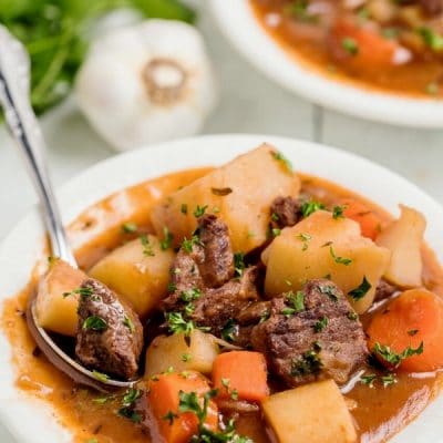 Hearty and delicious, this Beef Irish Stew is a family favorite. Slow simmering on the stove makes the beef incredibly tender and the addition of Guinness and red wine add to the complexity of the sauce. This beef stew is a perfect cool-weather meal and suitable for any Irish holiday. #noblepig #irishstew #stpatricksday #irishfood