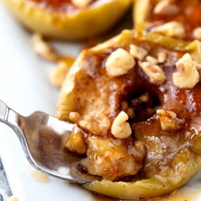 Baked apples with a spoon.