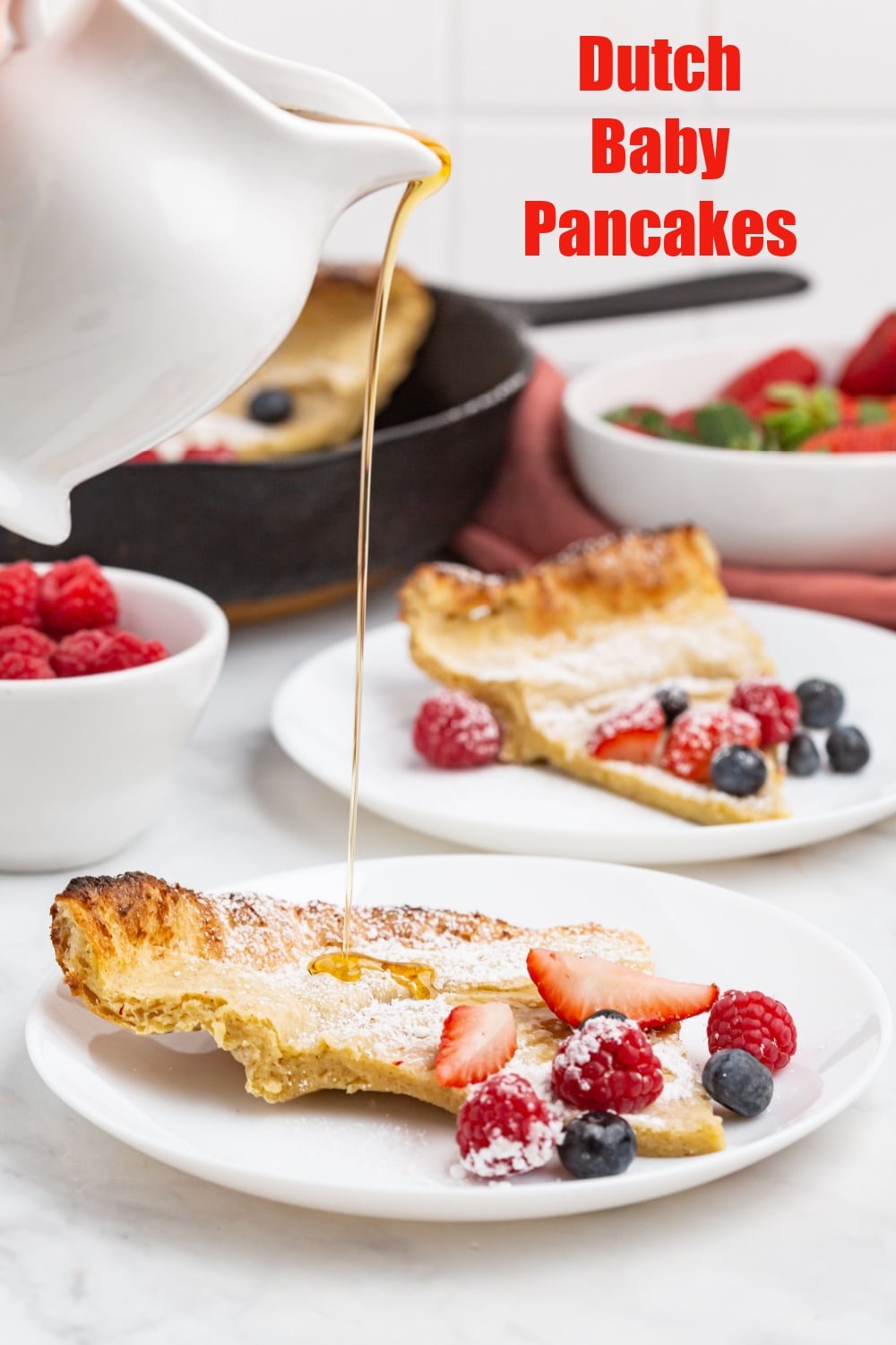 When the family is craving pancakes, serve up this baked and custardy version covered in sweet berries and wow everyone at the breakfast table. via @cmpollak1