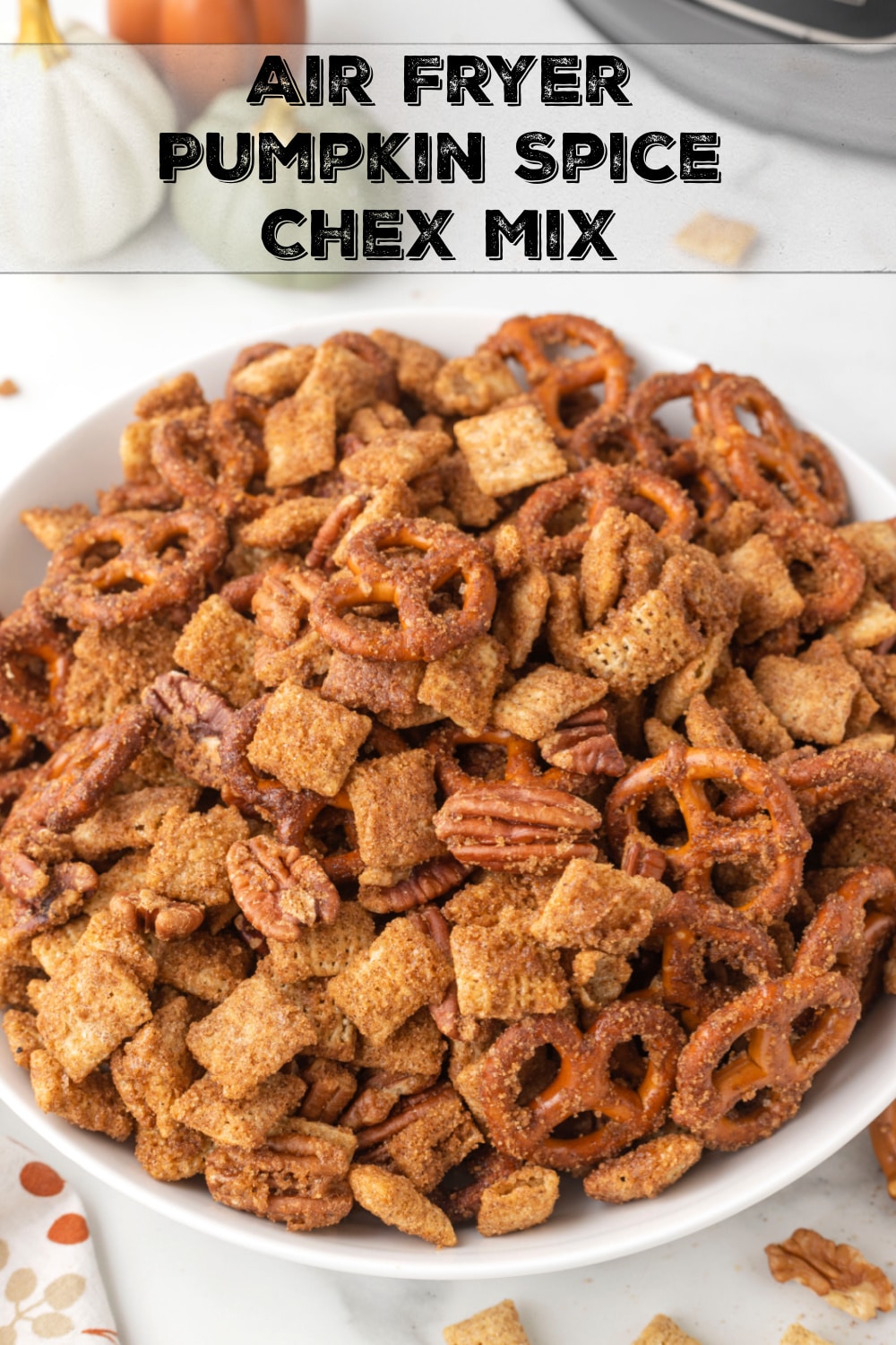 A seasonal sweet and crunchy cereal mix, made conveniently in the air fryer. This Pumpkin Spice Chex Mix is a must this holiday season. via @cmpollak1
