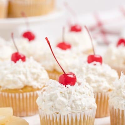 pina colada cupcakes with coconut whipped cream frosting