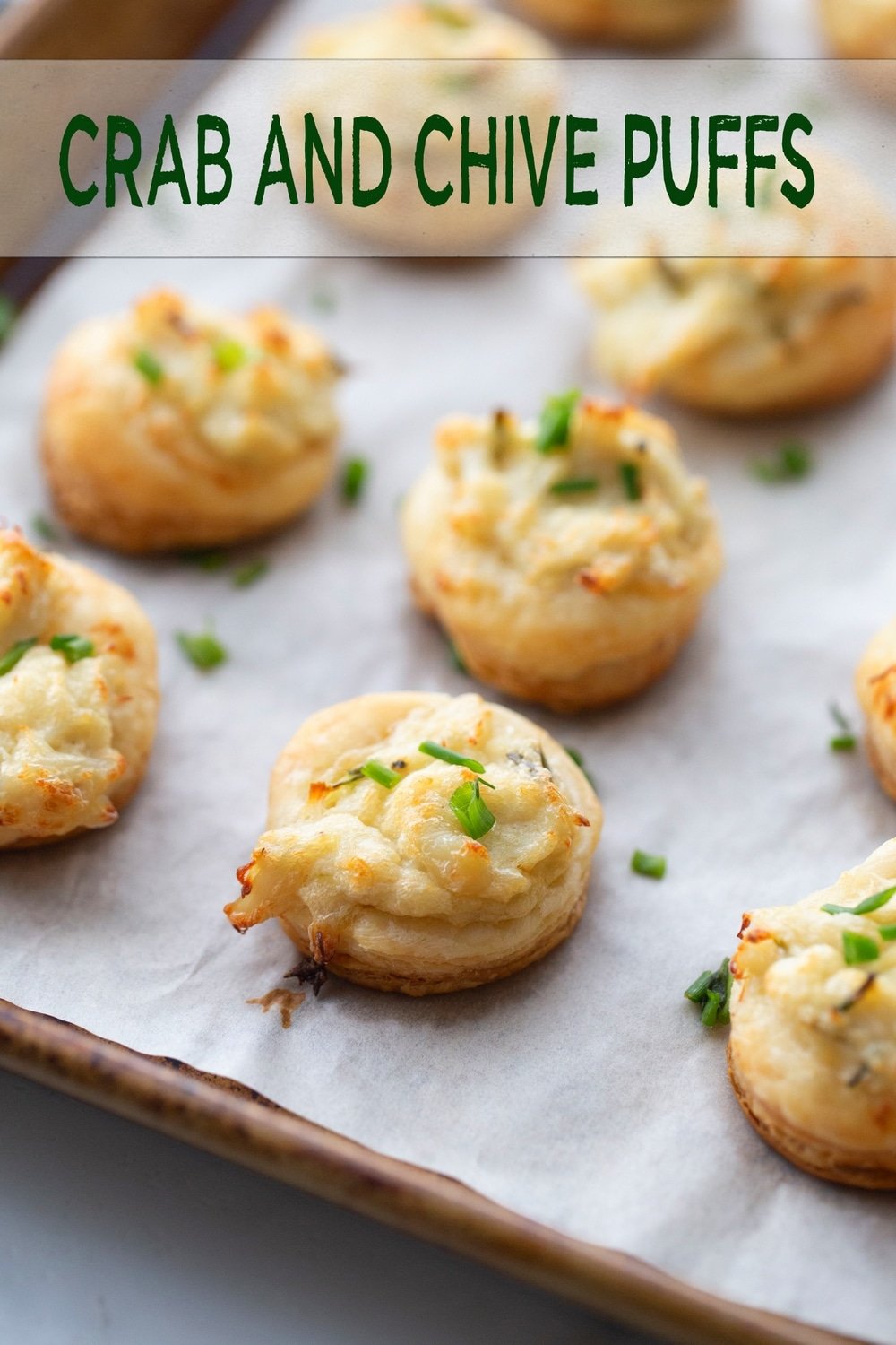 Impress your guests with these delicious and elegant Crab and Chive Puffs! Made with puff pastry, crab meat and a cream cheesy-chive mixture, these savory bites are the perfect party appetizer. Quick and easy to prepare, these puffs are sure to be a hit at any gathering. Perfect as finger-food or as a party starter, they're a must-try for any seafood lover! #CrabChivePuffs #PartyAppetizer #SeafoodAppetizer #EasyRecipes #FingerFood via @cmpollak1