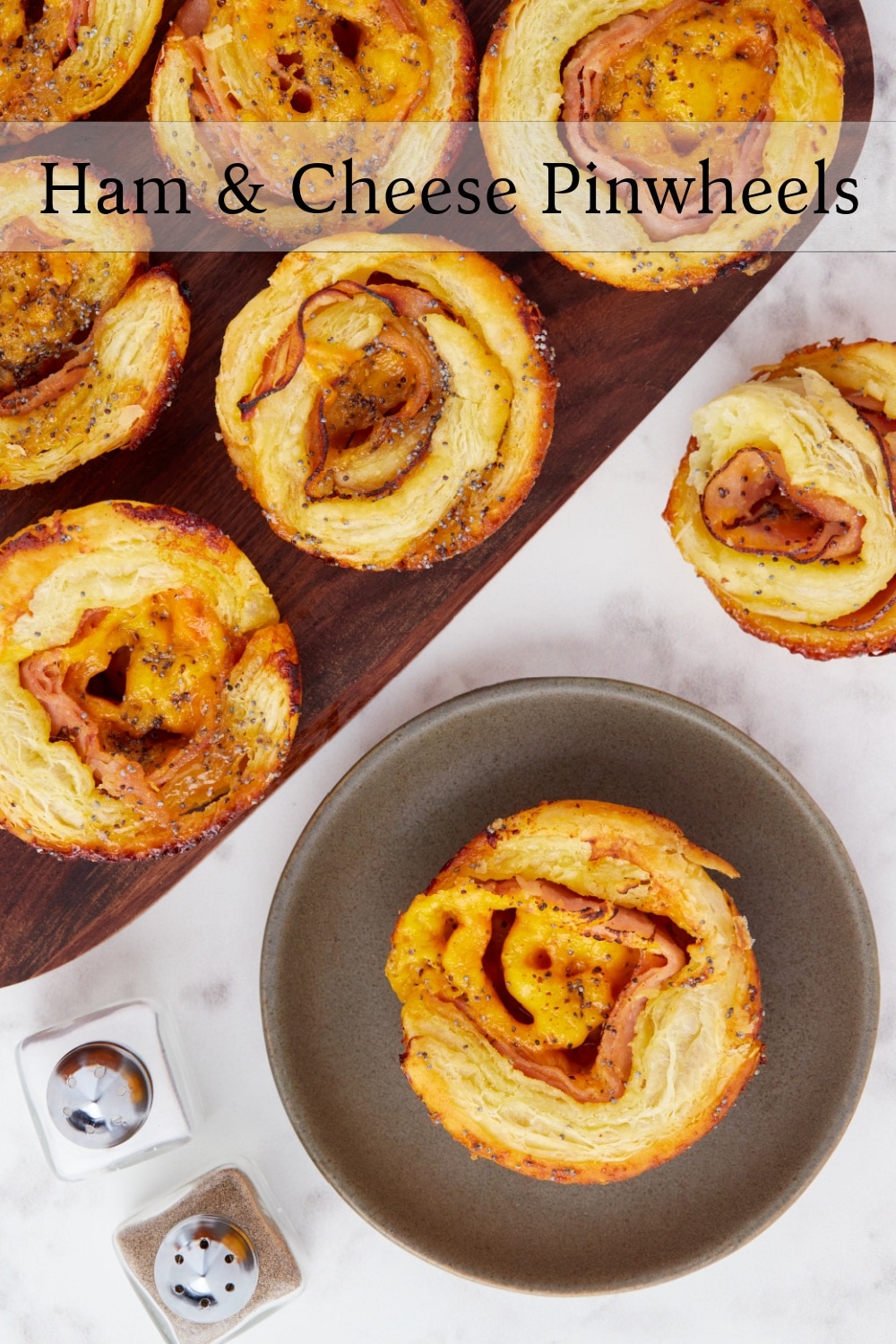 Transform your traditional appetizer pinwheels with this irresistible ham and cheese version. Experience the perfect balance of savory and slightly-sweet flavors with every bite. These pinwheels are flaky, buttery in the center, and crisp on the edges for the ultimate flavor and texture. Don't settle for flat-looking appetizers again, try this delicious twist on the classic pinwheel sandwich. via @cmpollak1