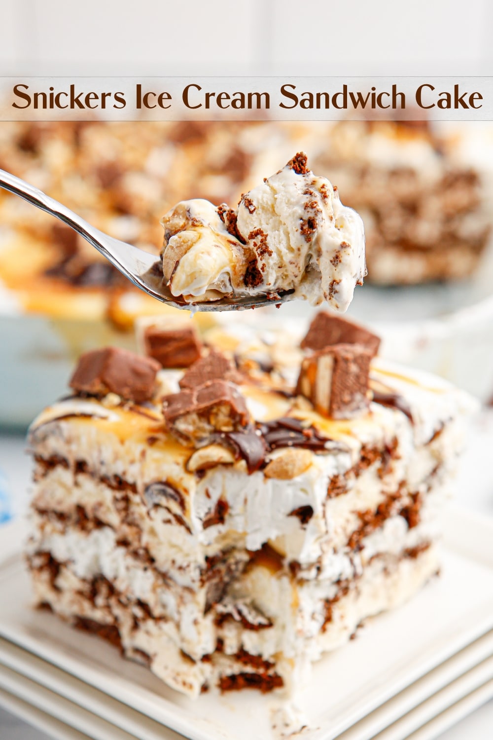 Easy and impressive, this indulgent Snickers Ice Cream Sandwich Cake is ready to serve at your next celebration. Layers of ice cream sandwiches and whipped topping create the base of this decadently, delicious treat.  via @cmpollak1
