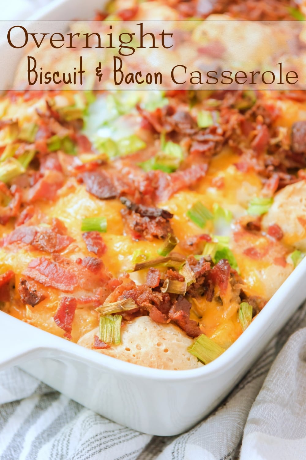 This Overnight (make-ahead) breakfast casserole with biscuits, bacon, sausage and tater tots is the perfect back-pocket recipe for when you are hosting brunch or overnight guests. This easy breakfast casserole recipe treats you to all the best parts of a breakfast plate in a single bite. via @cmpollak1