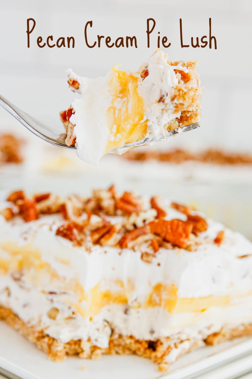 This Pecan Cream Pie Lush is a creamy and fluffy spinoff of traditional pecan pie. Tis layered dessert is no-bake and can be ahead of time. It's the perfect warm weather dessert for fans of pecan pie. via @cmpollak1