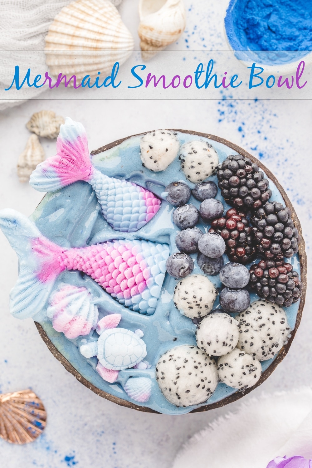 Dive into a mermaid adventure with this Mermaid Smoothie Bowl! Perfect for mermaid themed parties and little mermaid enthusiasts, this magical creation features a swirl of blue spirulina superfoods goodness. The DIY mermaid tails, crafted from frozen yogurt and natural colorings, add a touch of whimsy to your mermaid party food spread. Get ready to make a splash at your next mermaid themed party with this easy-to-make and health-packed treat. Your little mermaid's dreams will come true.  via @cmpollak1