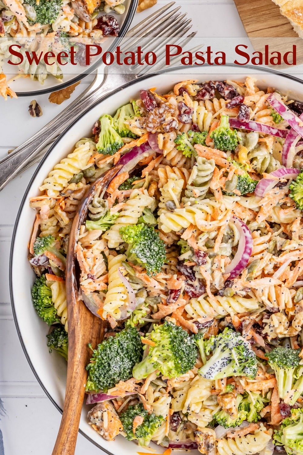 A fall pasta salad made with sweet potato, red onion and fresh broccoli with pasta noodles. A homemade poppy seed dressing ties all the flavors together. Perfect for tailgating, Halloween parties and as a cold Thanksgiving salad or side dish. via @cmpollak1