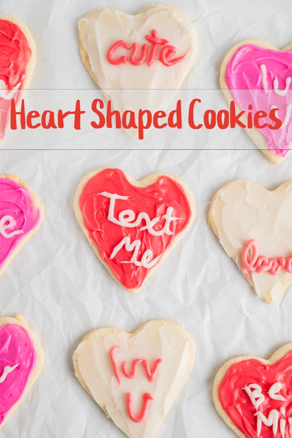 These heart shaped cookies resembling conversation heart candies are a perfect choice for Valentine's Day baking. The sugar cookie dough is simple to make and holds its shape in the oven. The best part - you don't need advanced baking or decorating skills to make these adorable cookies. via @cmpollak1