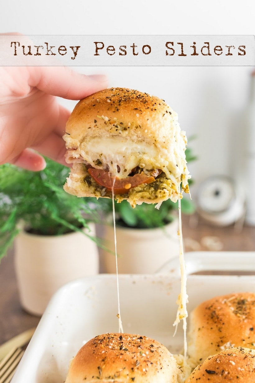 These pull-apart style turkey pesto sliders are layered with deli meat, fresh tomatoes, melty mozzarella cheese and your favorite pesto. Baked to golden perfection, these sliders are perfect for a busy weeknight or game day. via @cmpollak1
