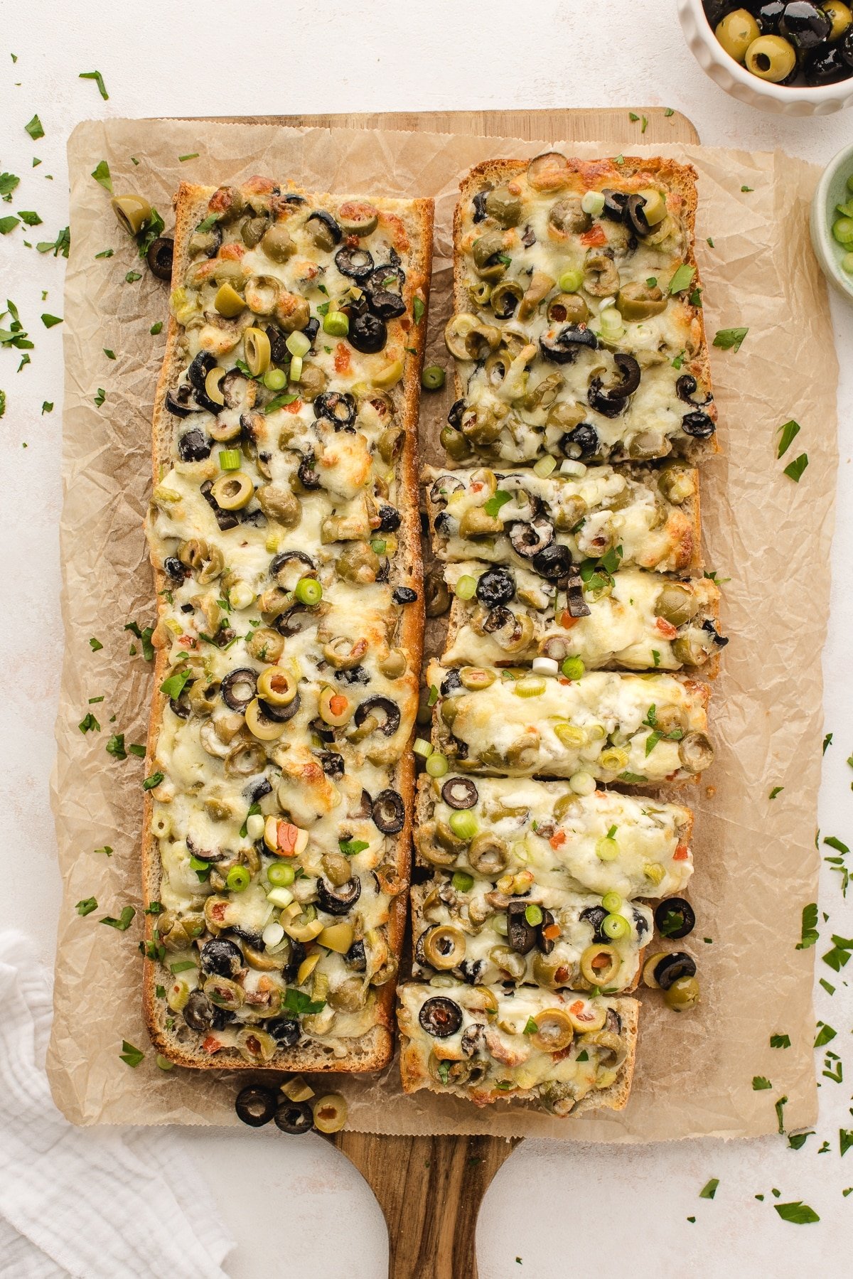 French bread with olive and cheese spread