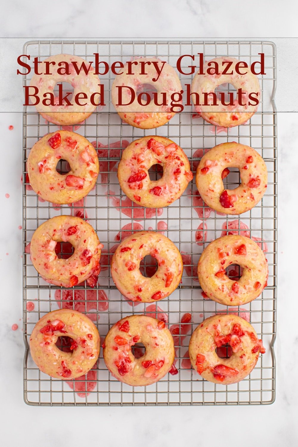 This is the perfect recipe for strawberry glazed baked doughnuts. What could better than fluffy vanilla doughnuts topped with a sweet and tangy, fresh strawberry glaze. These doughnuts are perfect for a weekend breakfast, back-to-school treat, brunch or a holiday morning.  via @cmpollak1