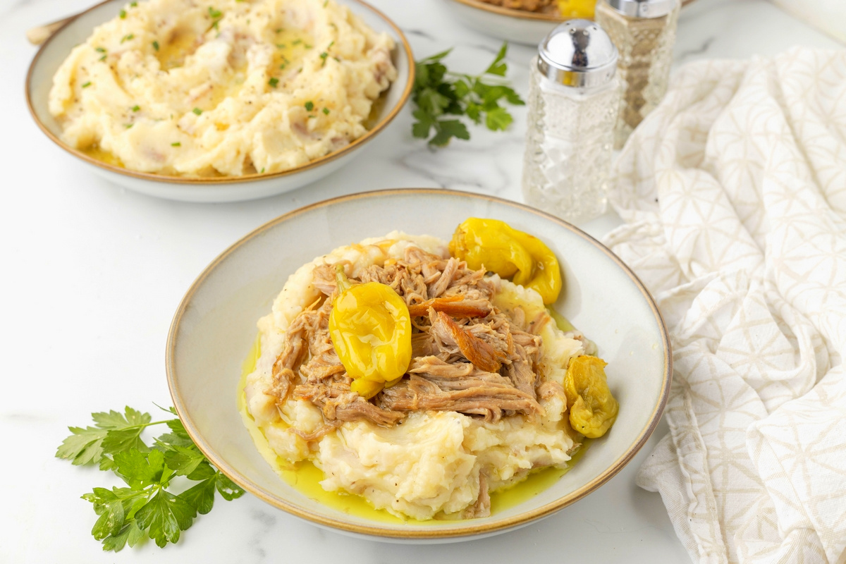 Mississippi Pot Roast with shredded pork. Mississippi pot roast in bowls