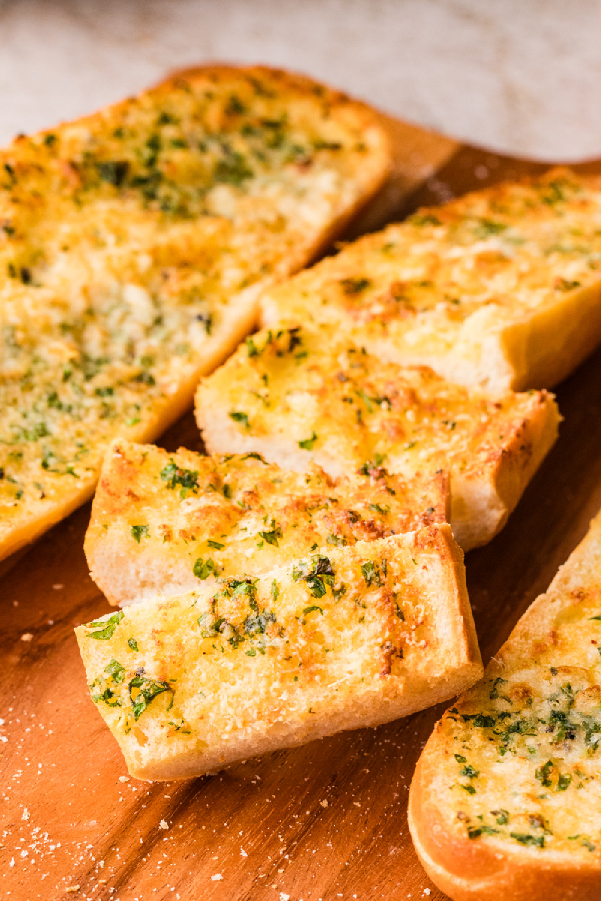 Garlic confit air fryer bread with golden, crisp edges and a soft center, finished with parsley and Parmesan