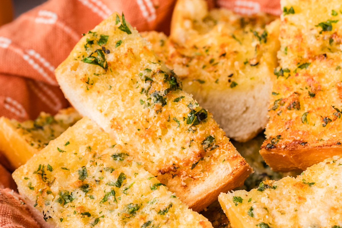 Close-up of crispy garlic bread made with garlic confit, showing golden crumb and soft interior