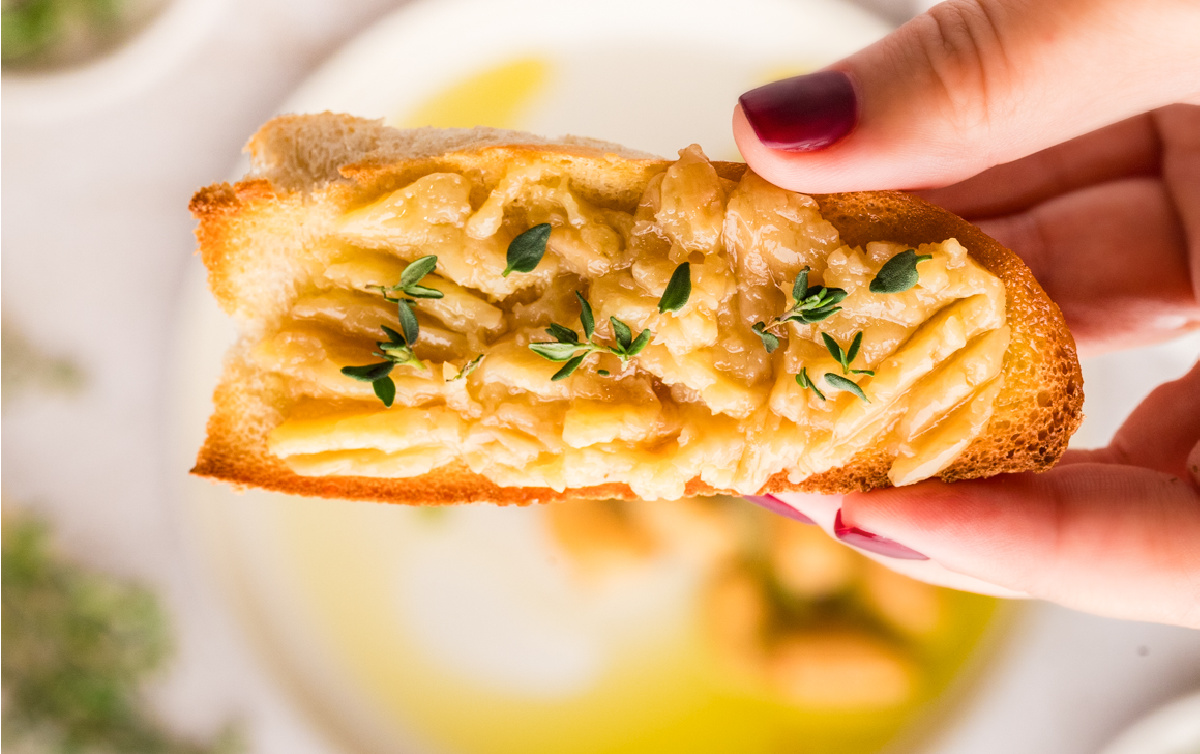 Garlic cloves mashed and spread over toasted bread with olive oil and thyme.
