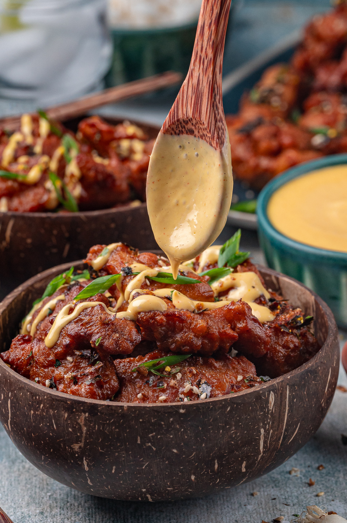 crispy mochiko chicken with creamy mango sauce drizzle